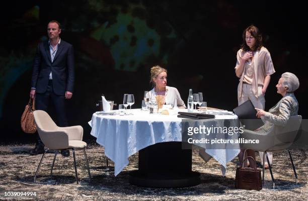 Mark Waschke , Nina Hoss , Stephanie Eidt and Lore Stefanek perform on stage during the photo rehearsal of the play 'Bella Figura' in the theatre at...