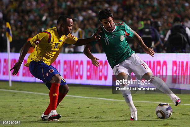 Carlos Vela of Mexico fights for the ball with Camilo Zuniga of Colombia during an international friendly match at Universitario stadium on September...