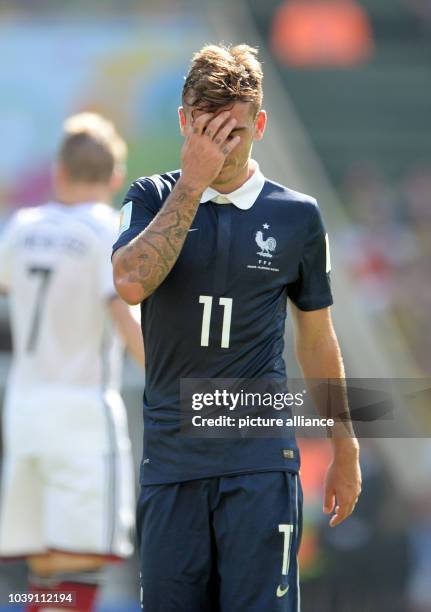 Mathieu Debuchy of France reacts during the FIFA World Cup 2014 quarter final soccer match between France and Germany at Estadio do Maracana in Rio...