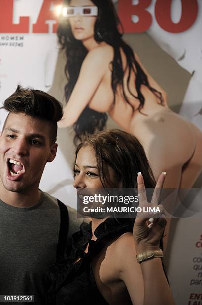 Paraguayan model Larissa Riquelme -- cover of the September issue of Playboy Brazil -- poses with her boyfriend, model Koke, after a press conference...