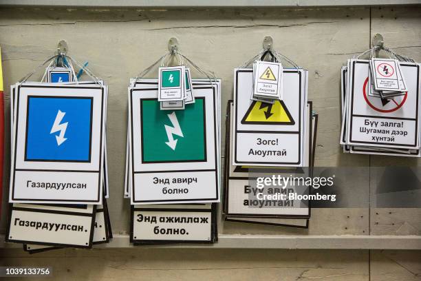 Warning signs hang at the Everyday Farm LLC Monnaran Solar Farm Project, a joint venture between Bridge LLC and Farmdo Co., in Ulaanbaatar, Mongolia,...