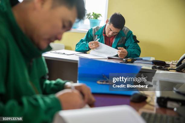 Workers work in an office at the Everyday Farm LLC Monnaran Solar Farm Project, a joint venture between Bridge LLC and Farmdo Co., in Ulaanbaatar,...