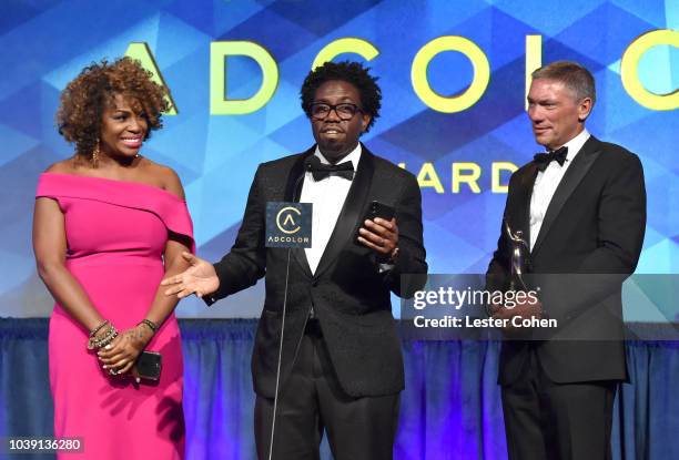 Liv Lewis, Mike Warner, recipient of The Most Valuable Partnership Award, and Andrew Robertson speak onstage during the 12th Annual ADCOLOR Awards at...