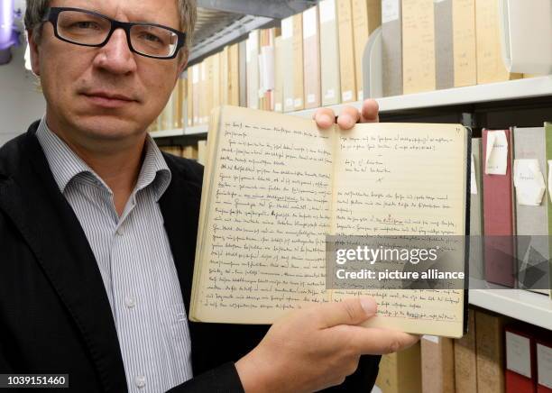 Director of the archive at the German Literature Archive Marbach, Ulrich von Buelow, presents a black notebook of Martin Heidegger in Marbach,...
