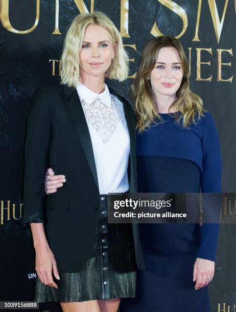 Actresses Charlize Theron and Emily Blunt pose during a photo call for the film 'The Huntsman & The Ice Queen' in Hamburg, Germany, 30 March 2016....