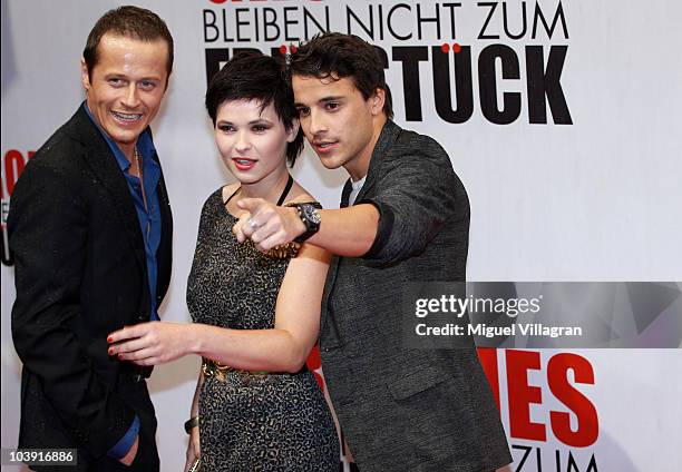 Actors Roman Knizka, Anna Fischer and Kostja Ullmann pose during the German premiere of the film 'Groupies Bleiben Nicht Zum Fruehstueck' on...