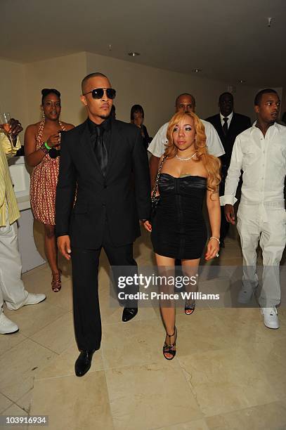 Clifford "TI" Harris and Tameka "Tiny" Harris attends the "Takers" premiere after party at 200 Peachtree on August 25, 2010 in Atlanta, Georgia.