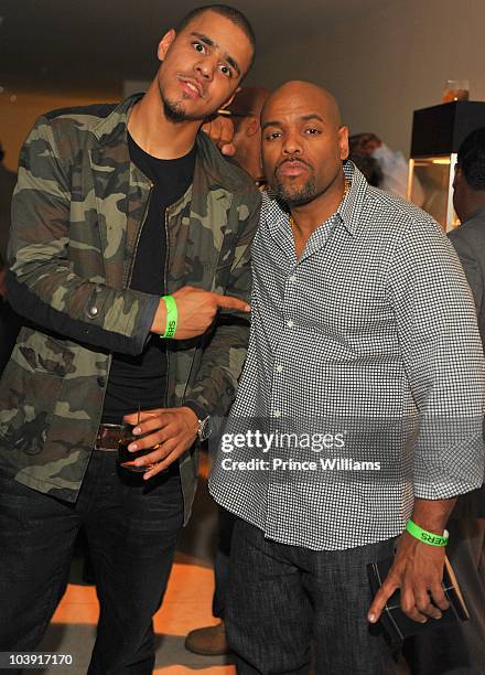 Cole and DJ Toomp attend the "Takers" premiere after party at 200 Peachtree on August 25, 2010 in Atlanta, Georgia.