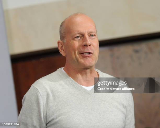 American actor Bruce Willis poses during a photocall for his new movie "A Good Day to Die Hard" in Berlin, Germany, 05 February 2013. Part five part...