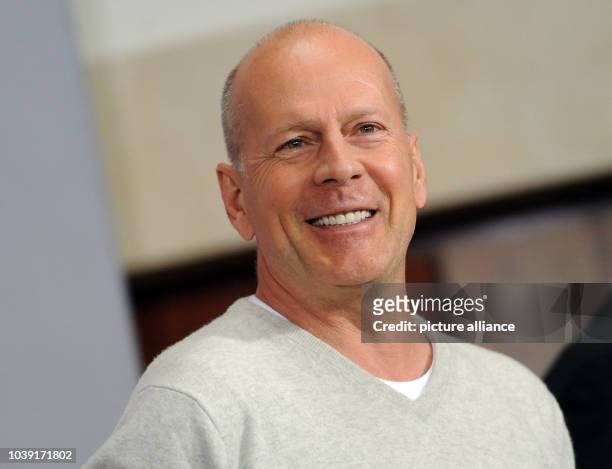 American actor Bruce Willis poses during a photocall for his new movie "A Good Day to Die Hard" in Berlin, Germany, 05 February 2013. Part five part...