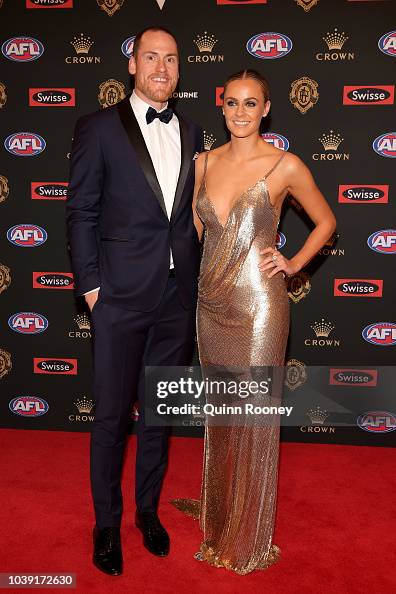 Jarryd Roughead of the Hawks and Sarah Roughead arrive ahead of the ...