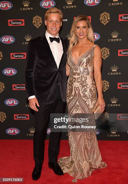 Isaac Heeney Of The Swans Poses With His Partner Laura Houghton As isaac-heeney-of-the-swans-poses-with-his-partner-laura-houghton-as