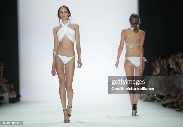 Models walk on the catwalk during the fashion show of the label 'Dimitri' by the Greek-Italian designer Dimitrios Panagiotopoulos at Mercedes-Benz...