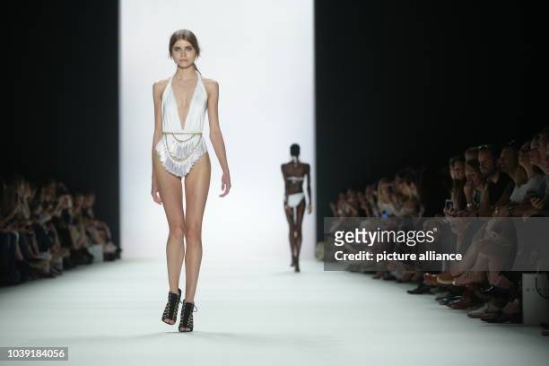 Models walk on the catwalk during the fashion show of the label 'Dimitri' by the Greek-Italian designer Dimitrios Panagiotopoulos at Mercedes-Benz...