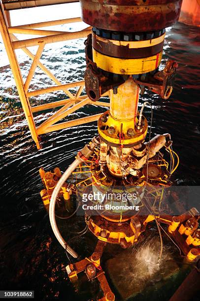 Crewmembers aboard the vessel Q4000 extract the damaged blow out preventer from the Deepwater Horizon oil rig from the Gulf of Mexico, U.S., in this...