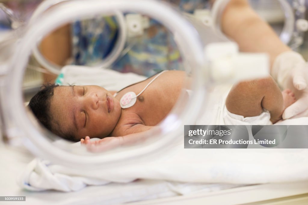 African American newborn baby in incubator