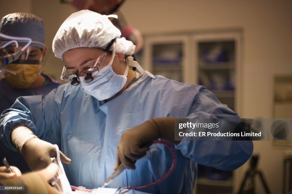 Doctor performing surgery in operating room