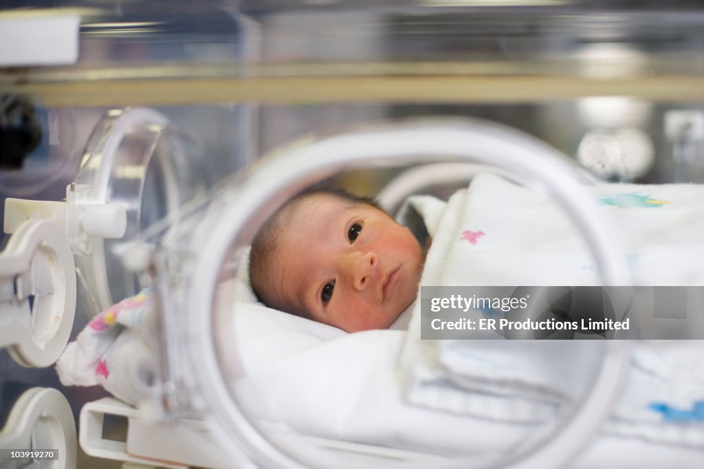 Hispanic baby in intensive care unit