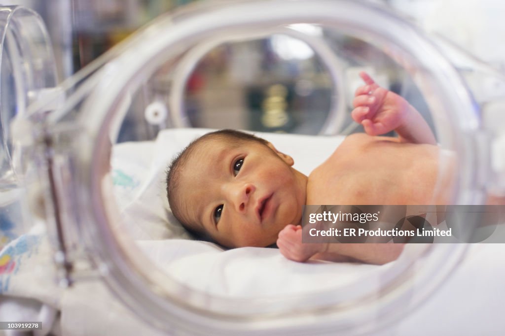 Hispanic baby in intensive care unit