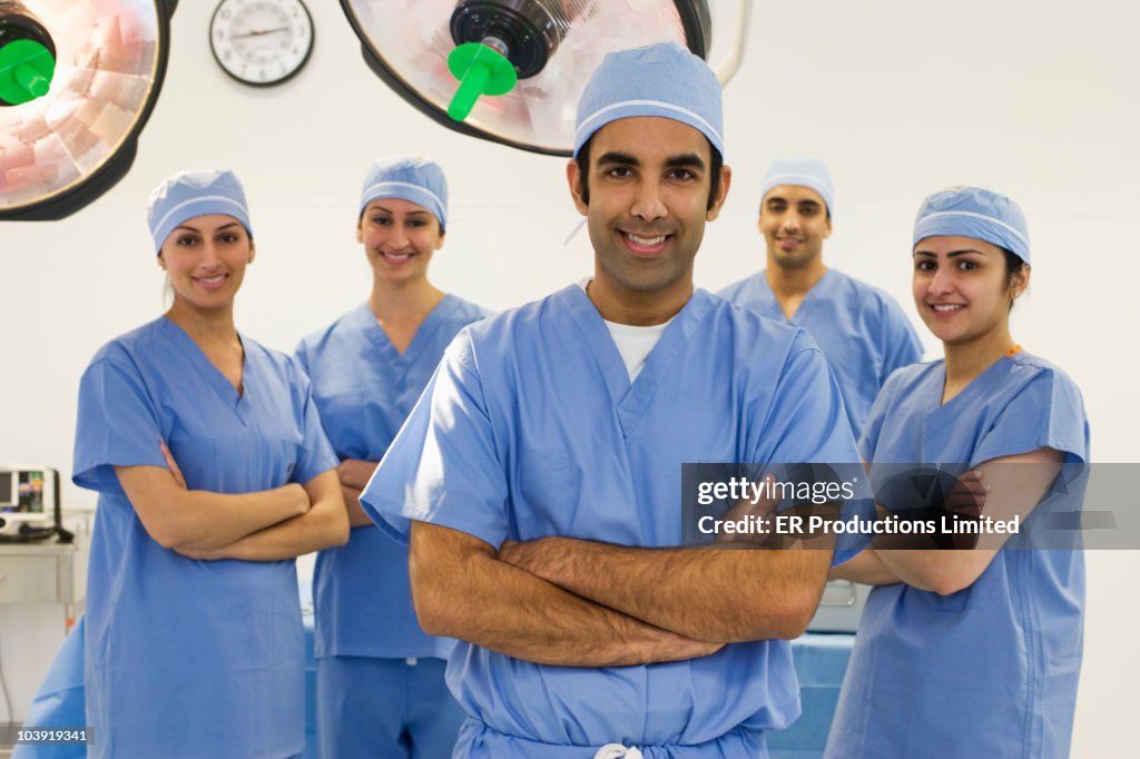 Surgeons smiling in operating room