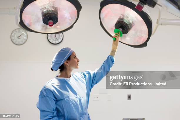 asian surgeon preparing for operation - doctor reaching stock pictures, royalty-free photos & images