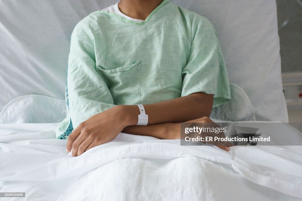 Mixed race boy in hospital bed