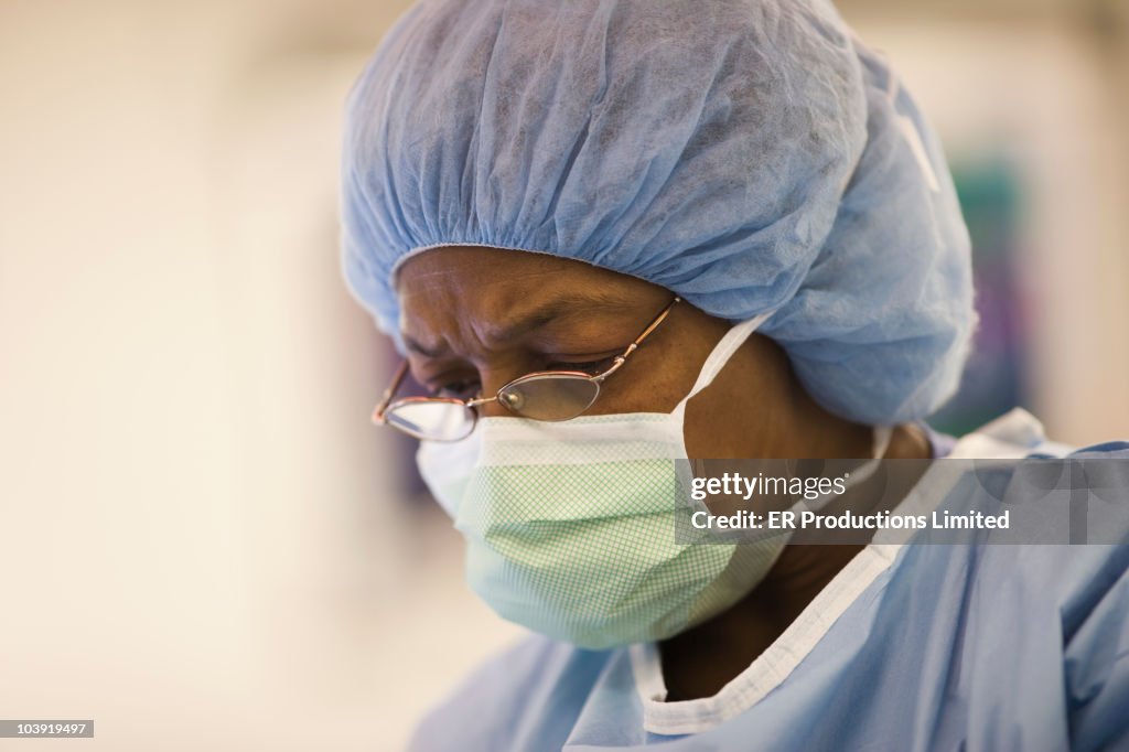 Doctor performing surgery in operating room