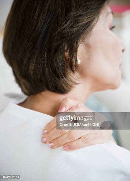 japanese woman rubbing neck and shoulders - shoulder ストックフォトと画像