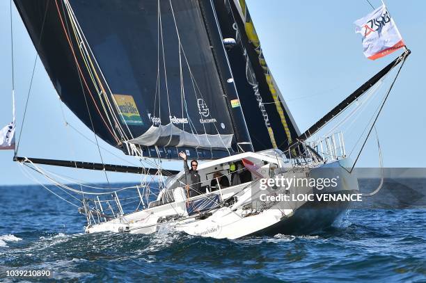 French sailor Louis Burton poses aboard his Imoca 60 monohull Bureau Vallee, as he sails from Lorient to Saint-Malo, on September 24 a few weeks...