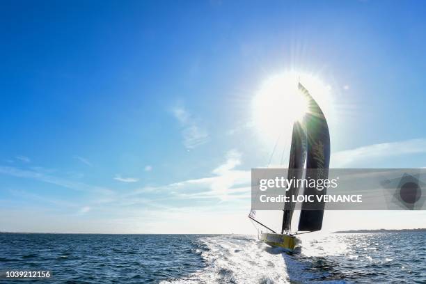 French sailor Louis Burton sails his Imoca 60 monohull Bureau Vallee, from Lorient to Saint-Malo, on September 24 a few weeks prior to the start of...