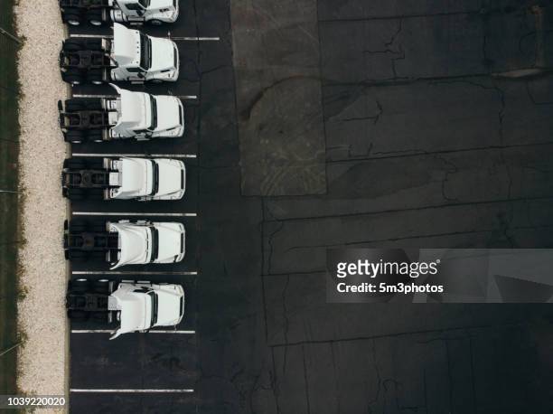 truck fleet 18 wheeler trucks aerial view - fleet of vehicles stock pictures, royalty-free photos & images