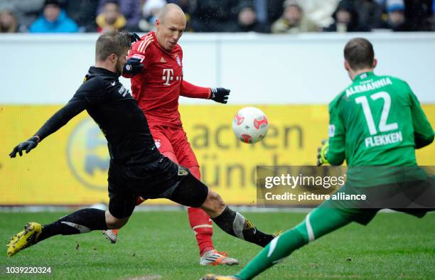 Munich's Arjen Robben vies for the ball with Aachen's Sascha Herroeder and Mark Flekken during the test match between Alemannia Aachen and FC Bayern...