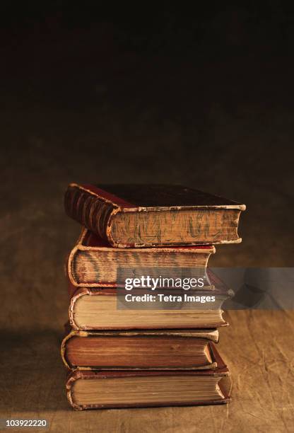 stack of antique books - old book stock pictures, royalty-free photos & images