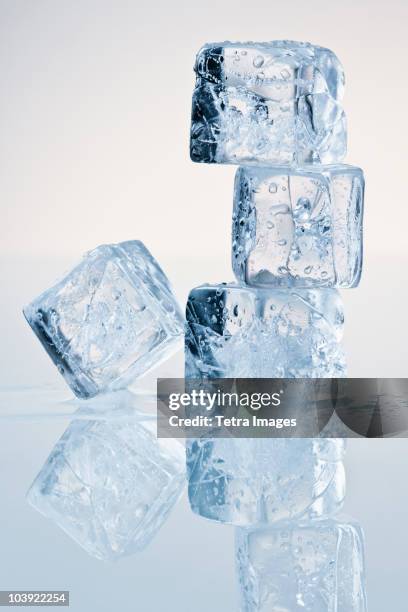 cubes of melting ice - eiswürfel stock-fotos und bilder