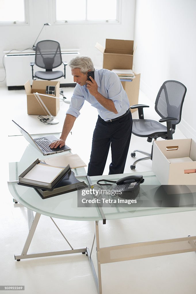 Businessman working in new office