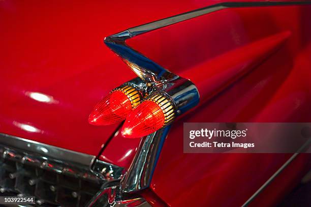 tail fin on a 1959 red automobile - 1950 1959 photos stock pictures, royalty-free photos & images