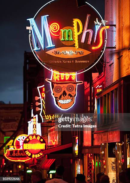 illuminated bar signs on beale street in memphis - memphis tennessee stock pictures, royalty-free photos & images