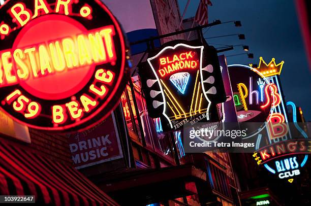 illuminated bar signs on beale street in memphis - memphis tennessee stock pictures, royalty-free photos & images