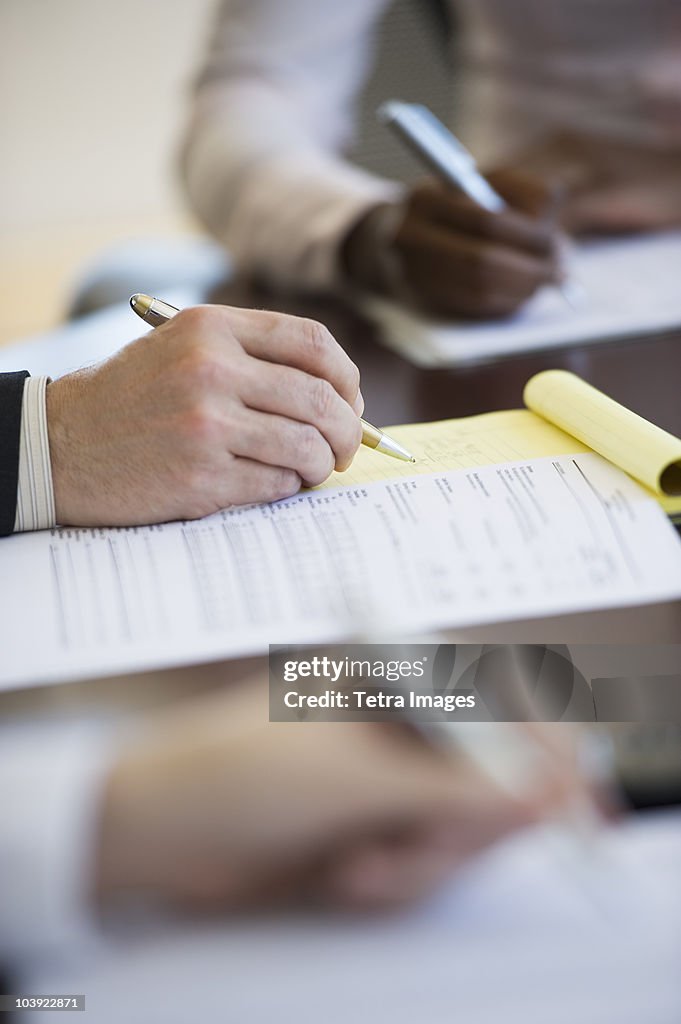 Business People Writing Notes During Business Meeting High-Res Stock ...