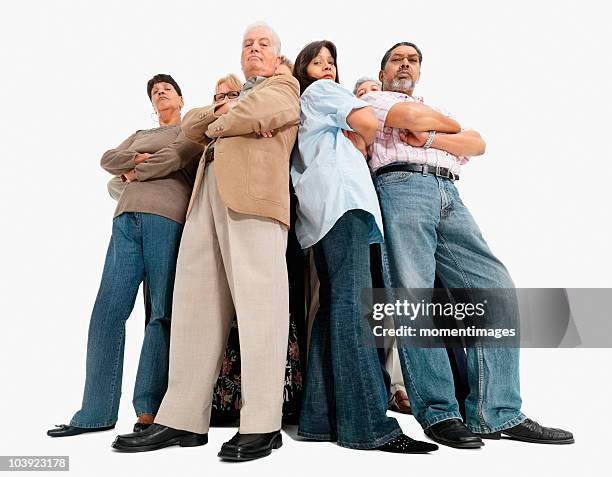 a group of a people standing with their arms crossed - senior woman studio stock-fotos und bilder