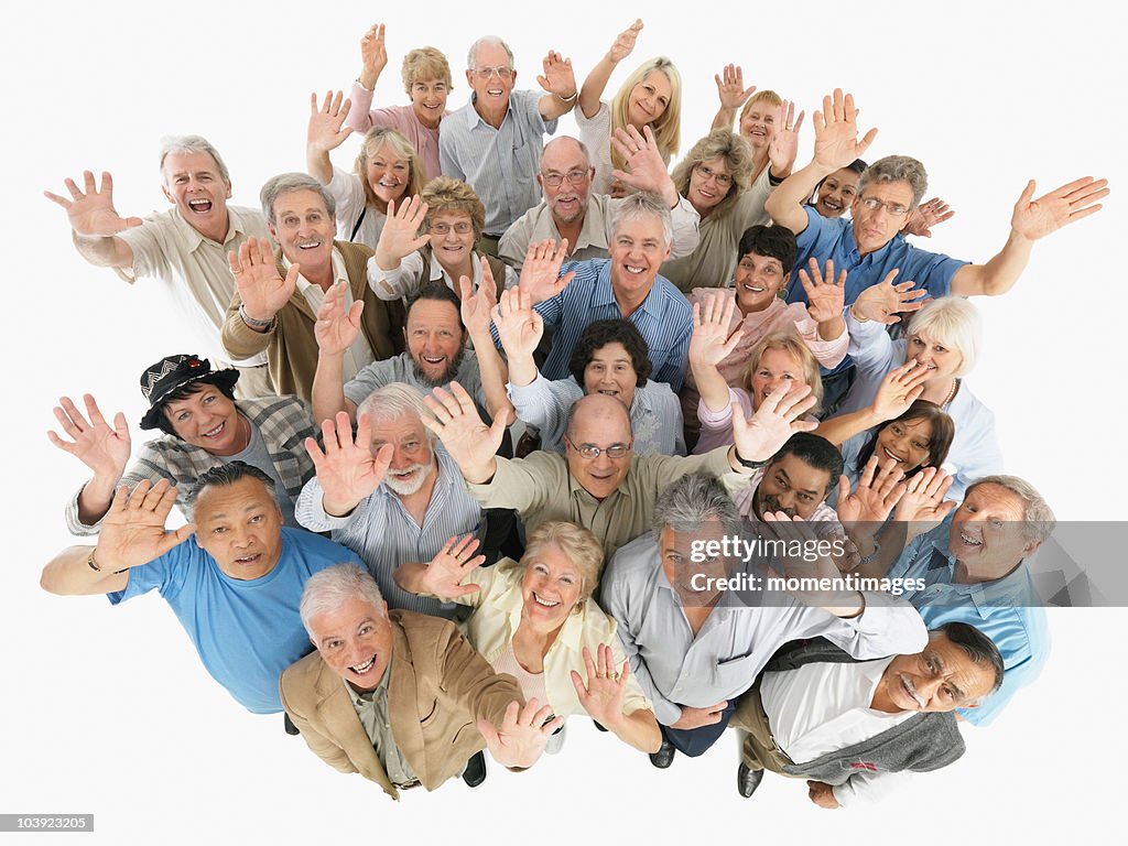 A group of people waving while looking up