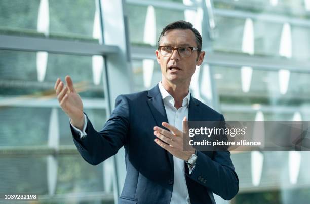 September 2018, Hamburg: Heiko Schäfer, CEO of the fashion label Tom Tailor speaks at the presentation of a new collection. Tom Tailor announced his...