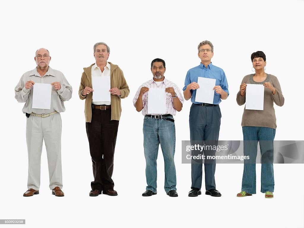 Group of people standing in a row holding papers