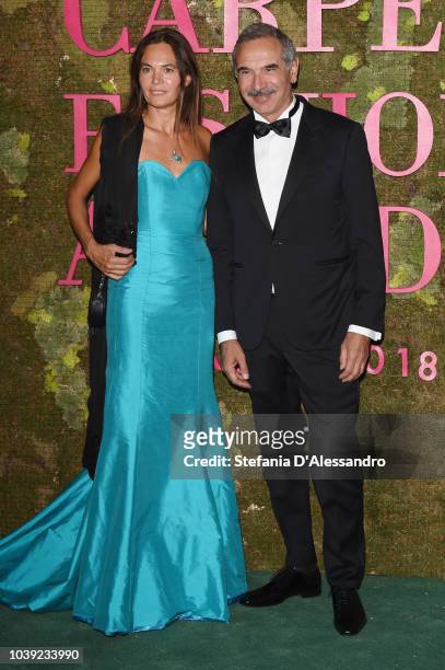 Carlo Capasa and a guest attend the Green Carpet Fashion Awards at Teatro Alla Scala on September 23, 2018 in Milan, Italy.