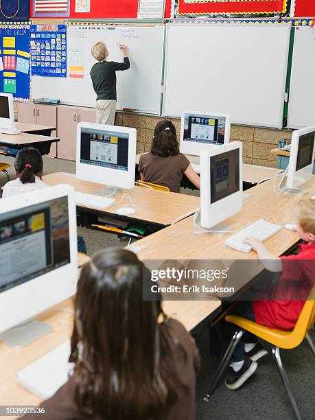 students in computer lab at school - interaktives whiteboard stock-fotos und bilder