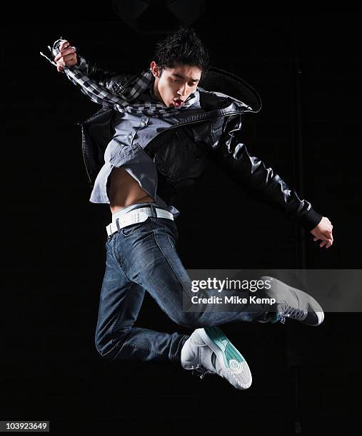 hip hop dancer jumping in the air - hip hopper stock pictures, royalty-free photos & images