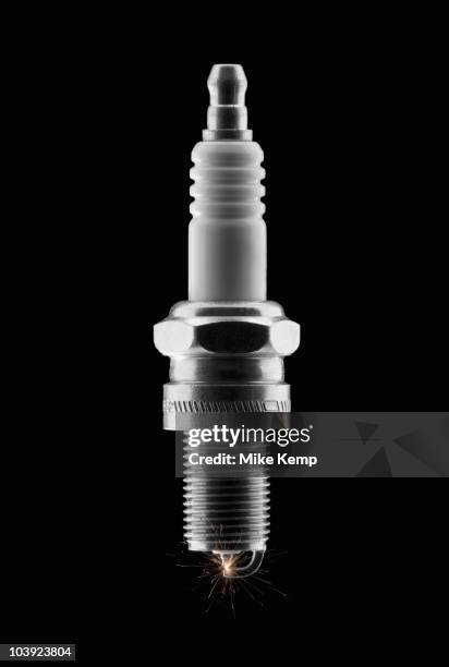 lit spark plug - spark plug stock pictures, royalty-free photos & images