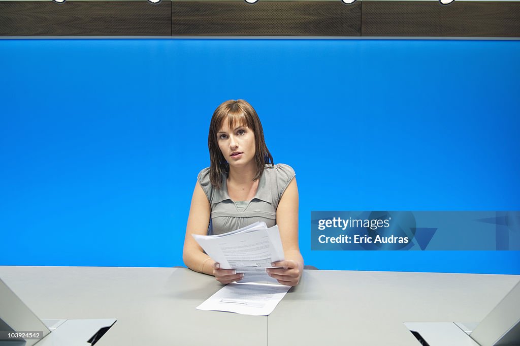 Businesswoman doing paperwork in a conference room