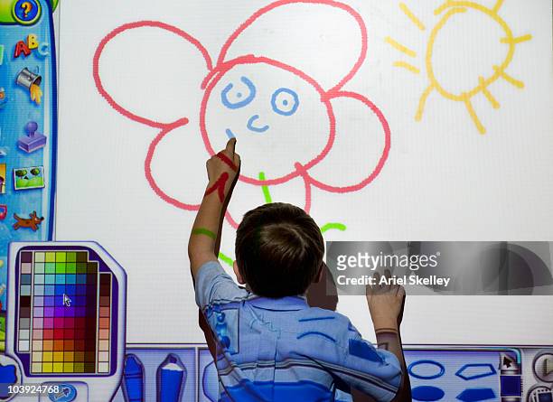 boy drawing on white board with technology - interactive whiteboard foto e immagini stock