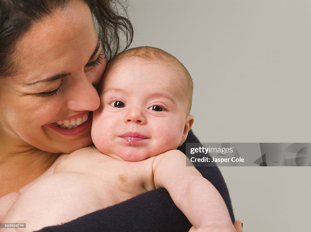 Mother holding newborn baby